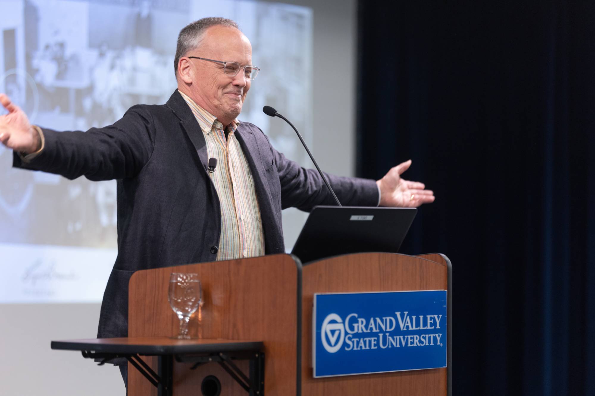 person speaking at a podium